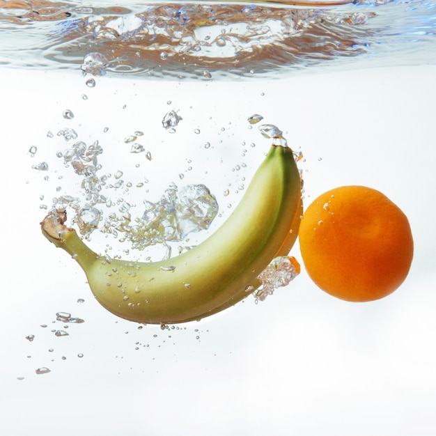 Bananas and orange fell into the water