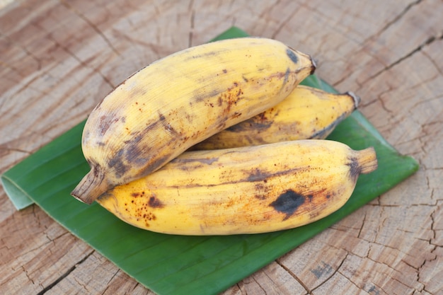 Bananas on a wood table.