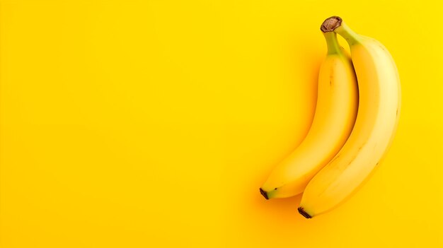 Bananas on a yellow background top view with copy space Closeup of ripe bananas