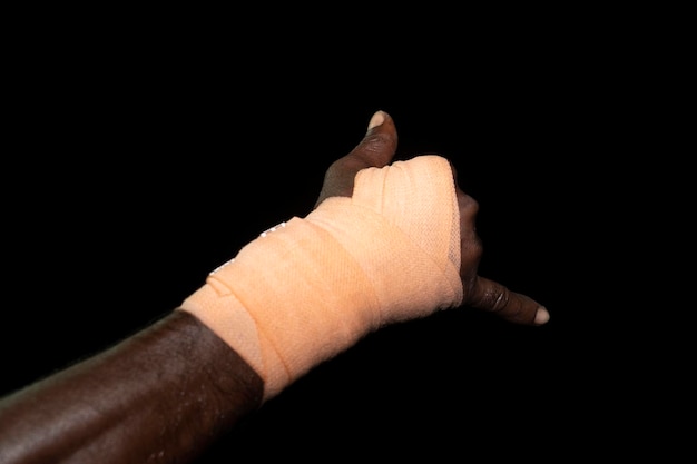 Bandage hands of black Migrant detail on boat