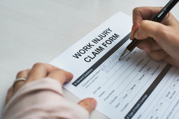 Bandaged woman filling out a form