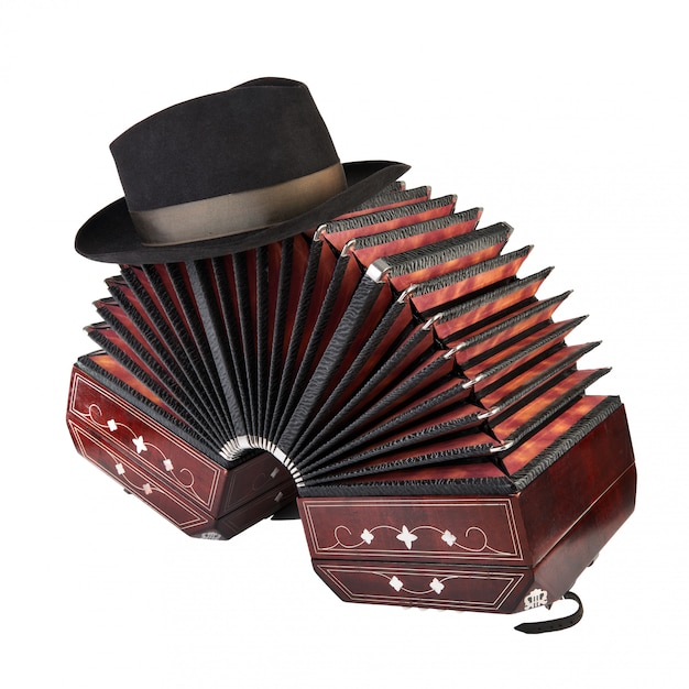 Bandoneon, tango instrument with a male hat on top