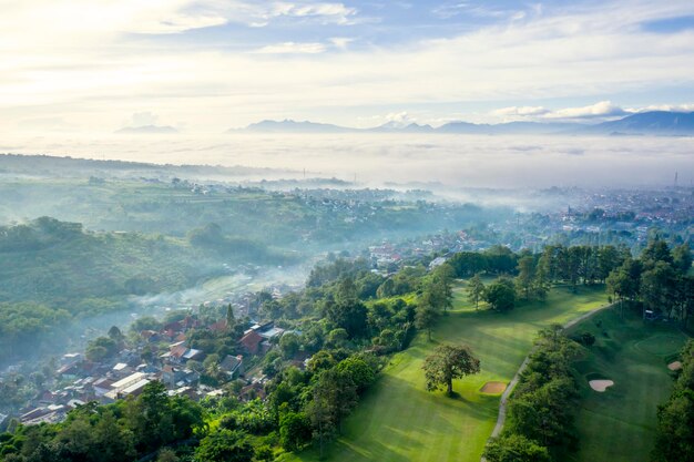 Bandung city with crowded houses and golf course