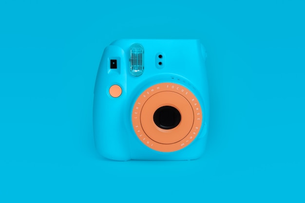 BANGKOK, THAILAND - Aug 05, 2021: polaroid camera Fujifilm Instax mini instant camera on blue color background.