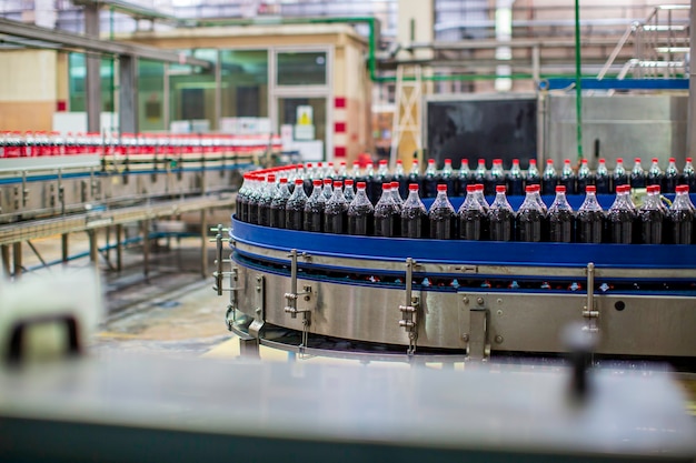 Bangkok thailand -june 10th, 2020  beverage factory interior. conveyor flowing with bottles for carbonated water.