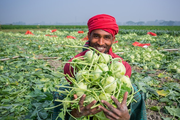 Bangladesh January 24 2020 A worker hands are full of turnip at Savar Dhaka Bangladesh