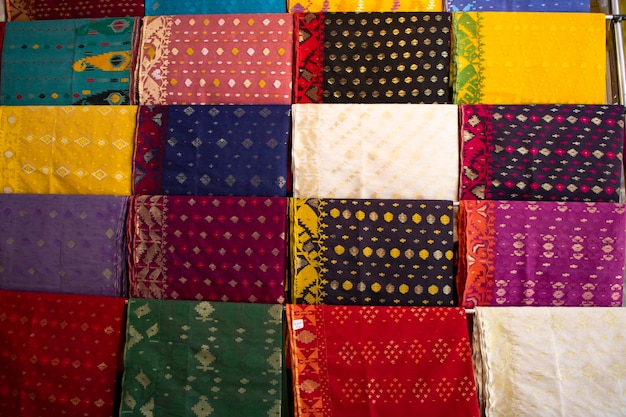 Bangladeshi  Traditional Colorful Jamdani saree hanging in the retail Showrooms