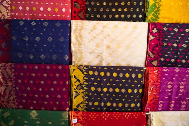 Bangladeshi  Traditional Colorful Jamdani saree hanging in the retail Showrooms