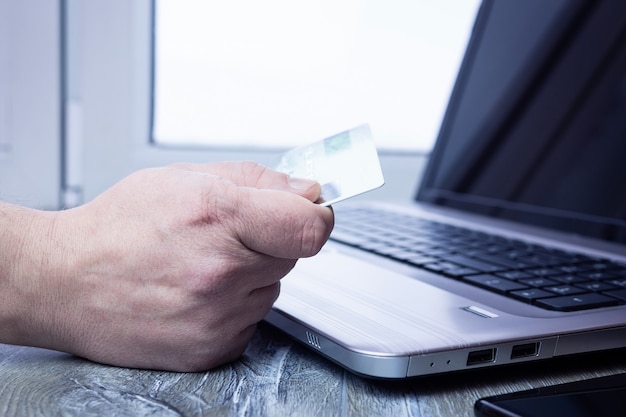 Bank card laptop businessman