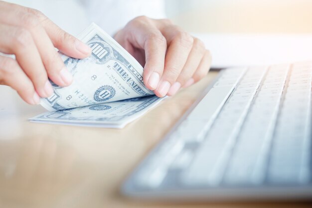 Bank employees are counting banknotes received or paid to customers.