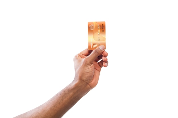 Banking services. Black male hand holding plastic credit card on white isolated studio background, copy space, cutout