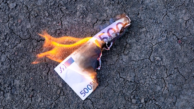 A banknote of 500 euros is on fire.