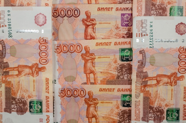 Banknotes of 5000 rubles on the table.