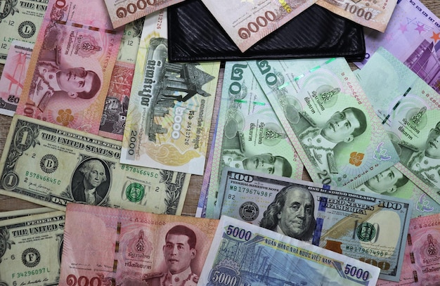 Banknotes of different countries and colors on the table