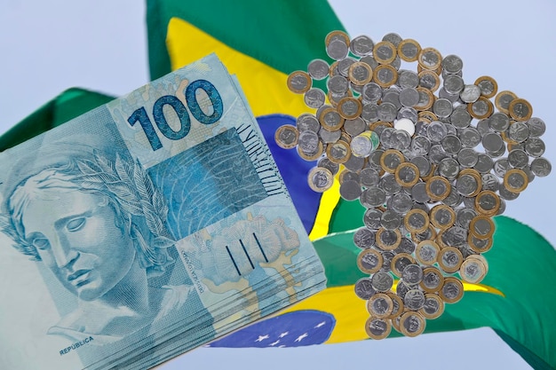 Banknotes of one hundred reais on white background