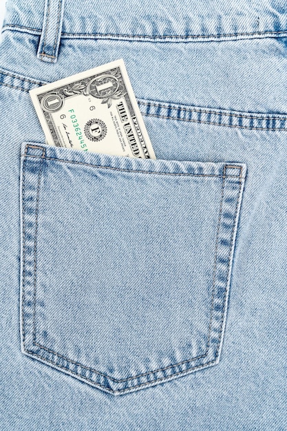 Banknotes in the pocket of blue jeans cash turnover one dollar bill