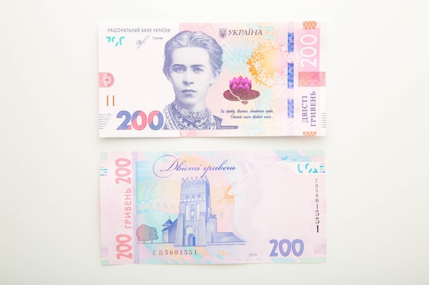 Photo banknotes ukraine 200 hryvnia on white surface