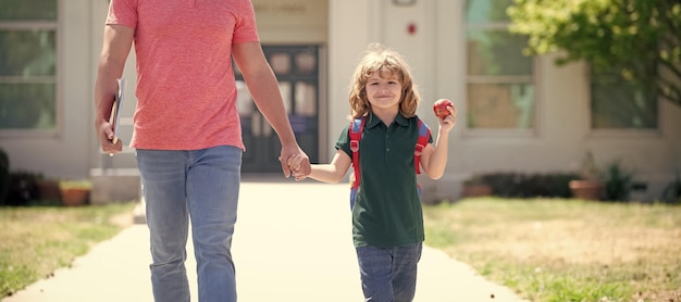 Banner of child back to school nerd with teacher hold apple
education first day at school father and son come back from
school