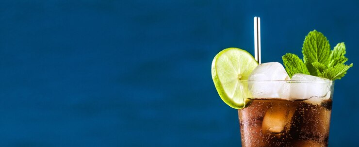 Banner of Coca Coke cocktail in a tall glass cuba libre refreshing summer drink