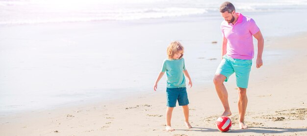 Banner of father and son play soccer or football on beach daddy with kid boy on summer day weekend family day dad and child have fun outdoors