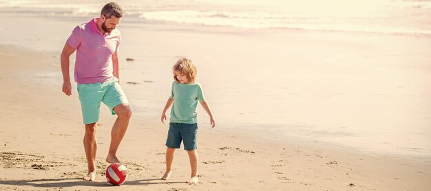 Banner of father and son play soccer or football on beach daddy with kid boy on summer day weekend family day dad and child have fun outdoors