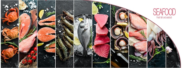 Фотография баннерная композиция из рыбы и морепродуктов на фоне черного камня