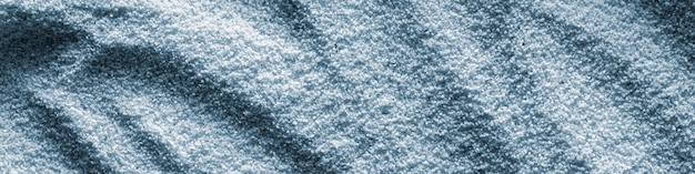 Banner horizontal sand blue light background format 41 with waves of sand macro photography