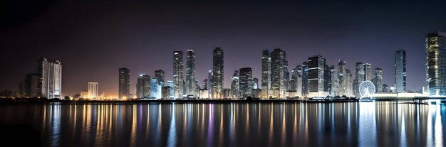 Banner image of skyscrapers by the sea at night