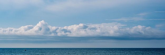 Banner long format crop it atmosphere panorama white cloud\
clear blue sky horizon line calm empty sea concept paradise life\
design relax wallpaper background more tone format collection in\
stock