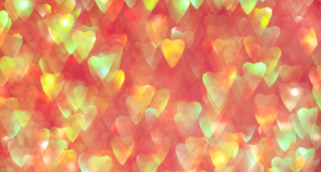 Фото Баннер из красочных сверкающих сердец с абстрактным боке для дня святого валентина
