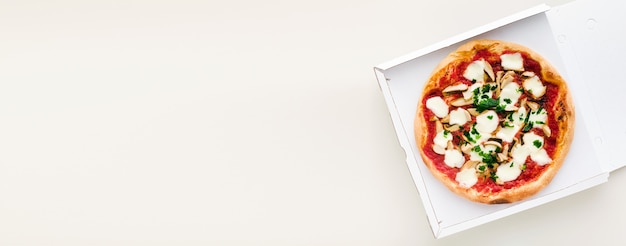 Banner of pizza with mushrooms in a box for delivery, advertising or menu