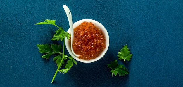 Banner of portion of red caviar on the table