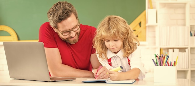 Banner of teacher and pupil school boy with laptop at lesson teacher man and kid study in classroom