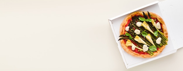 Banner of Vegan pizza asparagus in a box for delivery, advertising or menu