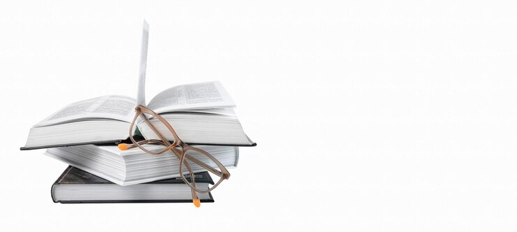 Banner with books stack and eyeglasses isolated on white background Education and reading hobby concept Place for text High quality photo