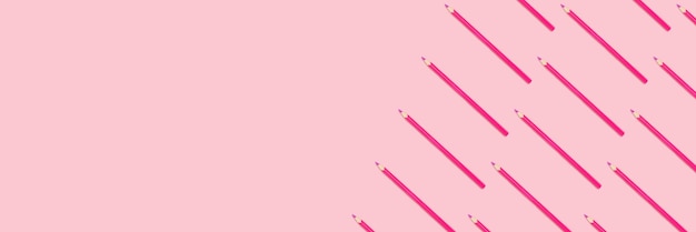 Banner with pink pencils pattern on a pastel background