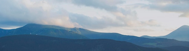 Banner with a view of the mountains in the clouds