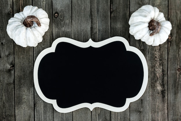 banner with white pumpkins on a wooden background