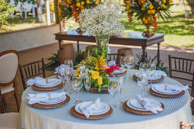 Banquet tables in nature Garden wedding Outdoor wedding Buffet Wedding party in nature Festive table dishes table compositions glasses candles and plates