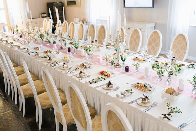 Banquet wedding table in a restaurant or cafe in beige and brown colors