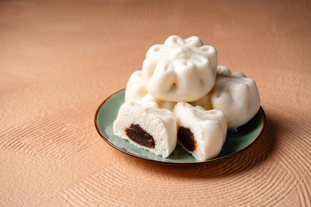 baozi or chinese steamed buns is a type of yeastleavened filled bun in various chinese cuisines