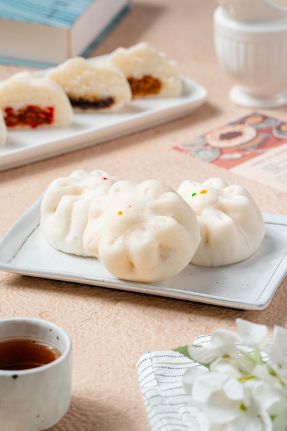 baozi or chinese steamed buns is a type of yeastleavened filled bun in various chinese cuisines