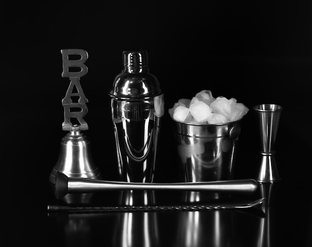 bar accessories for drinks isolated on black background