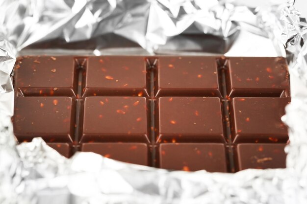 Photo bar of chocolate in foil closeup