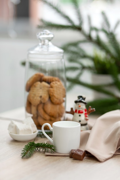 Bar counter in a coffee shop with New Year's decorations, cookies, sweets and coffee