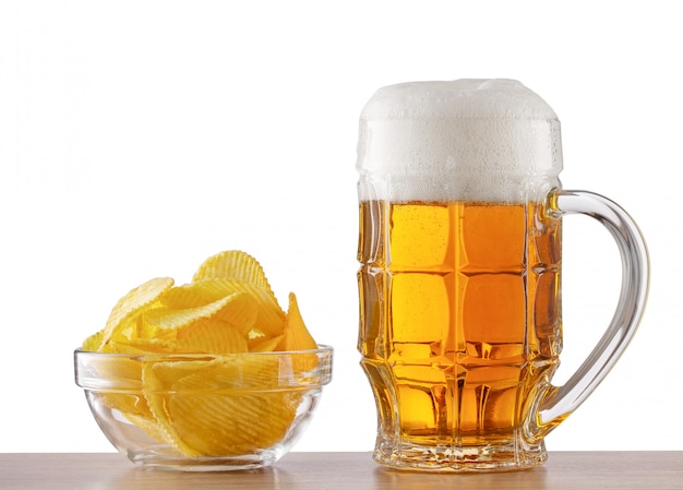 Bar counter with glass of beer and plate of chips