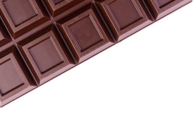 A bar of dark chocolate on a white backgroundCopy space