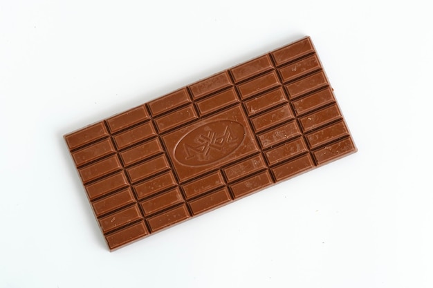 Bar of milk chocolate white background