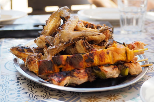 Barbacue meat outdoors in a plate ready to eat