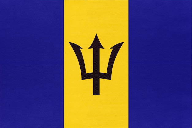 Barbados national fabric flag, textile background. Symbol of american world country.